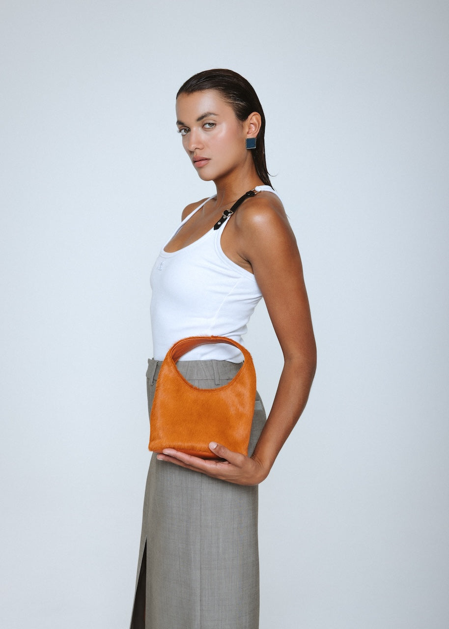 Detailed view of The Jill Bag's genuine leather and pony hair finish