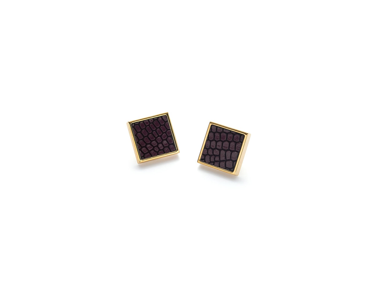 Detailed view of the gold finish and Bordeaux leather on Vesper Mini Earrings
