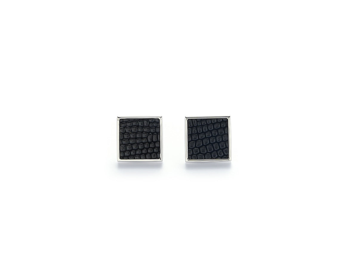 Close-up of Vesper Mini Earrings featuring black lizard-embossed leather